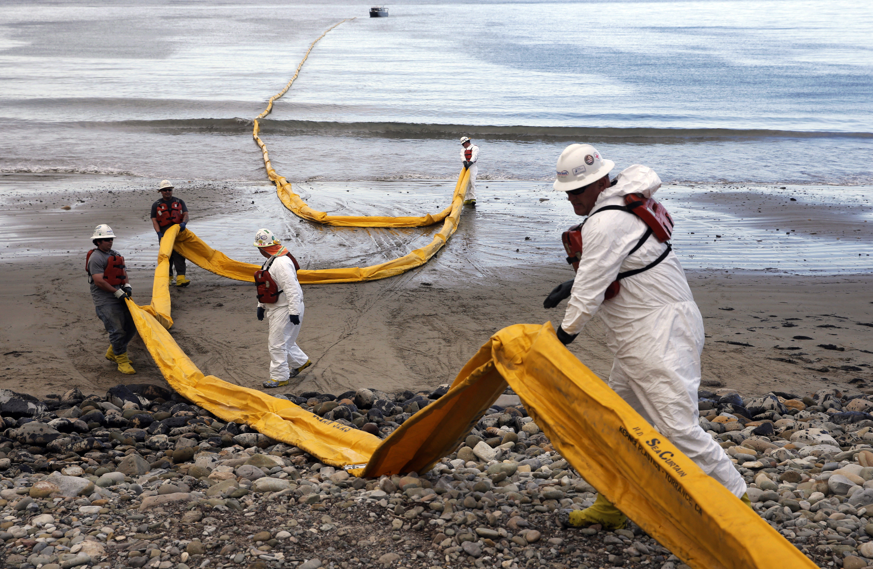Workers in 2015 prepare an oil containment boom at Refugio State Beach, north of Goleta, California, two days after a ruptured pipeline created the largest coastal oil spill in California in 25 years. Workers in 2015 prepare an oil containment boom at Refugio State Beach, north of Goleta, California, two days after a ruptured pipeline created the largest coastal oil spill in California in 25 years.