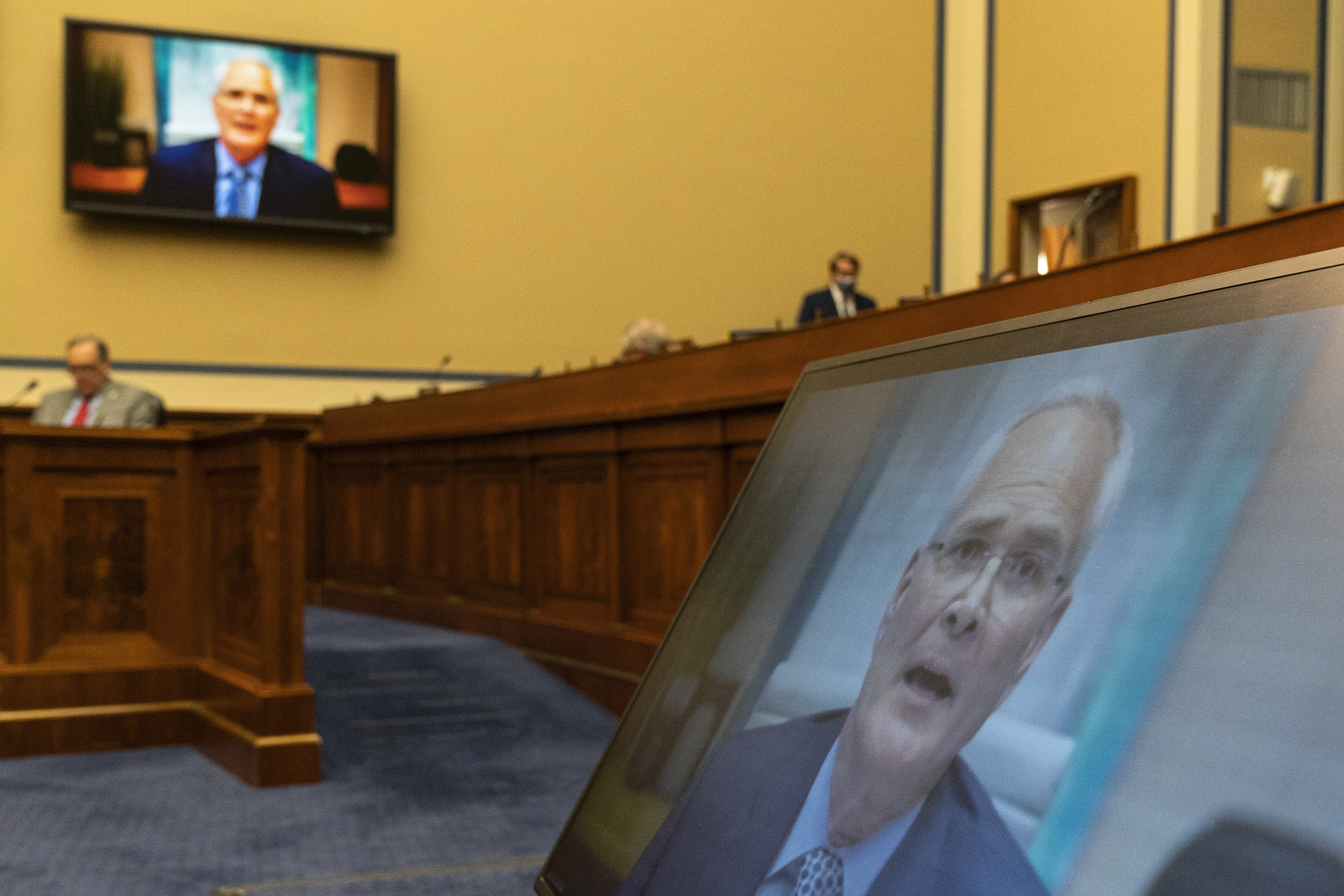 Darren Woods, CEO of Exxon Mobil, testifies via video conference. Darren Woods, CEO of Exxon Mobil, testifies via video conference.
