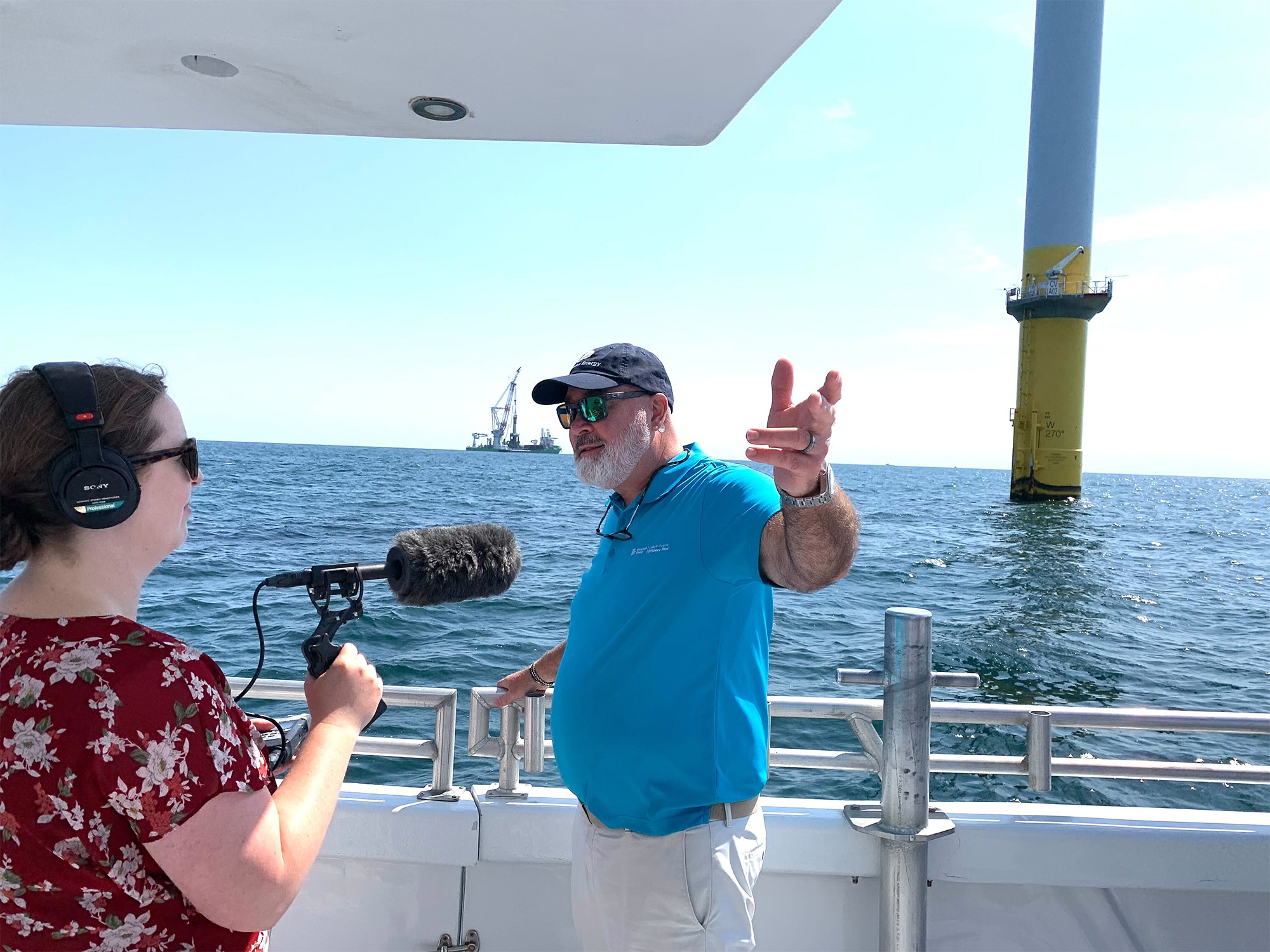 Dominion Energy’s John Larson speaking to a radio reporter during construction of the company’s 176-turbine wind farm this summer. Dominion Energy’s John Larson speaking to a radio reporter during construction of the company’s 176-turbine wind farm this summer.